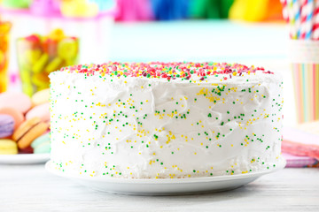 Birthday cake on colorful background