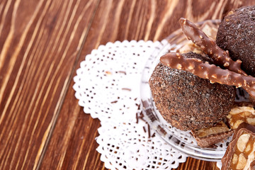 Cupcake with chocolate on wooden background