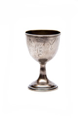 Antique silver glass of wine with engraving isolated