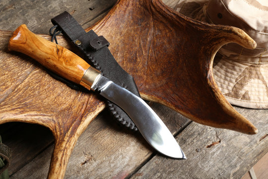 Hunting gear on wooden board, closeup