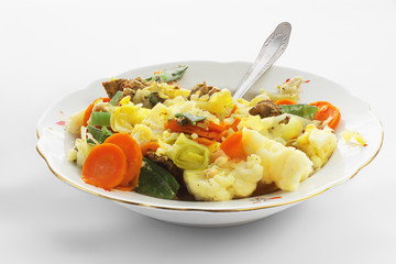 Stew with a meat and  vegetables in a plate