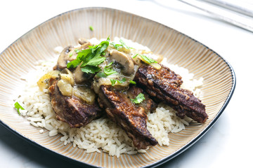 fried livres with mushroom sauce and rice