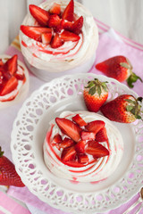 Pavlova meringue cake decorated with fresh strawberry