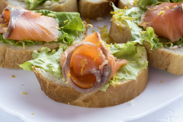 Sandwiches with red fish .