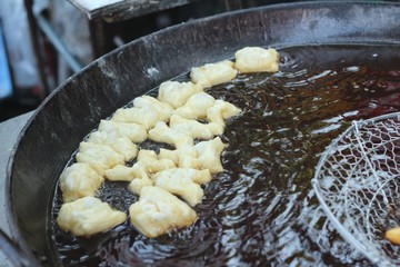 Deep-fried dough stick in pan