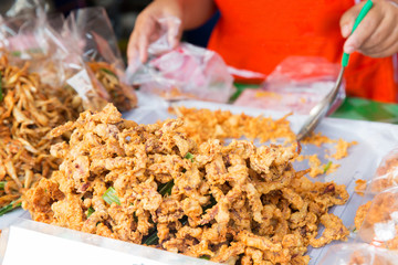 close up of cook hands and snacks at street market