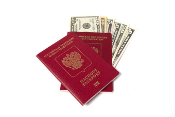 Russian passports and Dollar USA on white background.