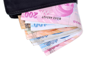Turkish money and wallet on white background