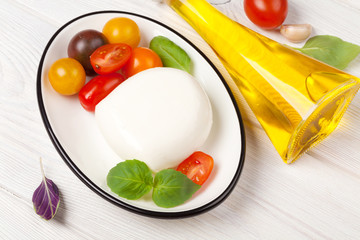 Mozzarella, tomatoes, basil and olive oil
