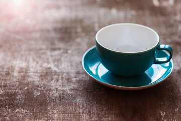 Coffee cup on a wooden table background