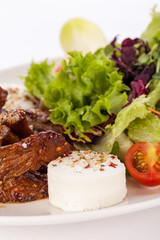 grilled beef stripes fresh salad and goat cheese