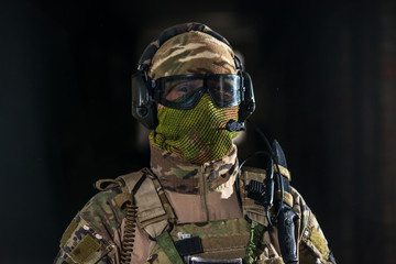 Airsoft strikeball player in military soilder uniform