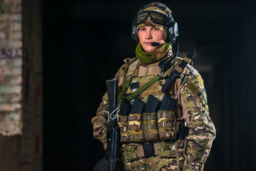 Airsoft strikeball player in military soilder uniform