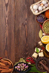 Various spices on wooden background © evgeeenius