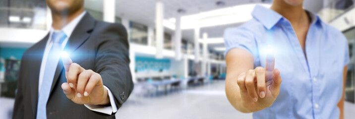 Man and woman using digital interface