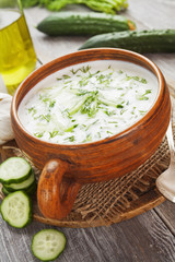 Summer soup with cucumbers, yogurt and fresh herbs
