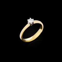 Gold ring on black background