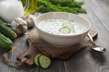 Summer soup with cucumbers, yogurt and fresh herbs