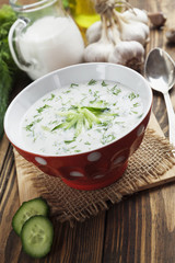 Summer soup with cucumbers, yogurt and fresh herbs