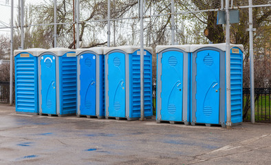 Row of portable toilets on the outdoor