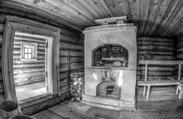 Interior of traditional russian wooden bath with brick oven. Bla