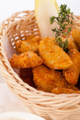 Crumbed chicken nuggets in a basket