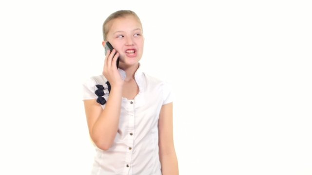 School girl using mobile phone and calls somebody, smiles on