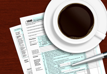 tax form 1040 with pen and coffee on wooden table