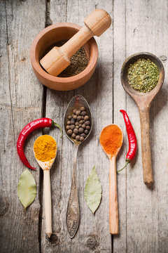 Colorful spices on a wooden background