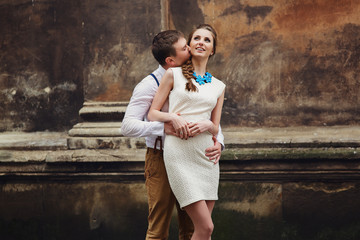 couple walk in old town lviv,kissing,loving