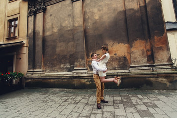 couple walk in old town lviv,kissing,loving