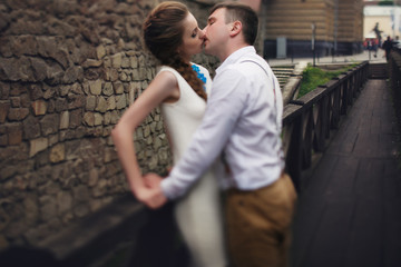 couple walk in old town lviv,kissing,loving. On the roof