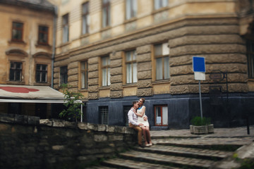 couple walk in old town lviv,kissing,loving. On the roof