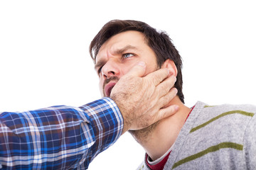 Closeup of young man being slapped in the face