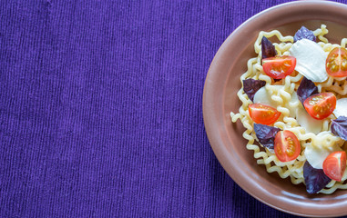 Fusilli lunghi with cheese and cherry tomatoes