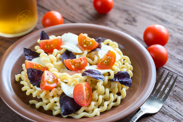 Fusilli lunghi with cheese and cherry tomatoes