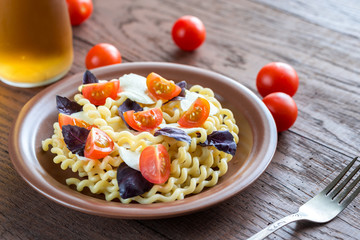 Fusilli lunghi with cheese and cherry tomatoes