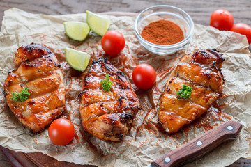 Grilled chicken breasts in hot mango sauce
