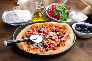 american pizza with salami,beans and mais