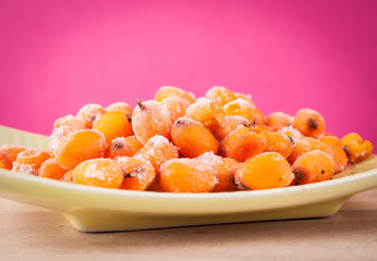 Hippophae rhamnoides on wooden table