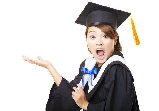 surprised young woman graduating holding diploma and looking