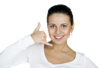Young happy smiling brunette woman with call me gesture