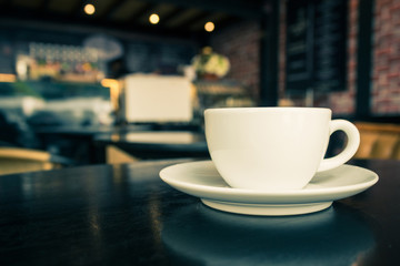 Coffee cup on the table at the coffee shop.