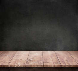 Wood table with dark concrete texture background