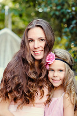portrait of Young happy beautiful mother and daughter