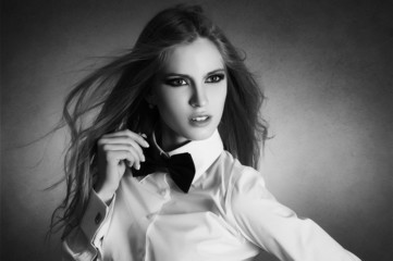Blondie woman in white shirt and black bow-tie
