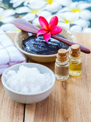 Spa and wellness treatment setup on wooden panel.