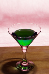 Martini glass on wooden table