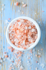 himalayan pink salt on wooden surface