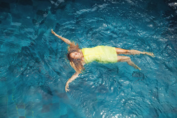 Fototapeta na wymiar woman in a pool, top view